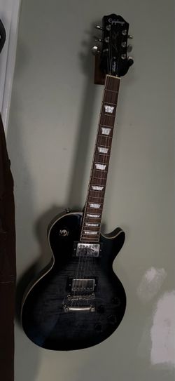 Les paul tribute plus epiphone electric guitar with fender amp