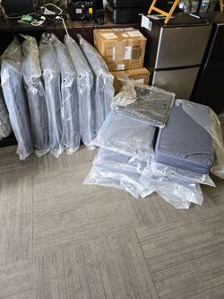 Gray Upholstered Chair Parts – Set of Multiple with water cover.