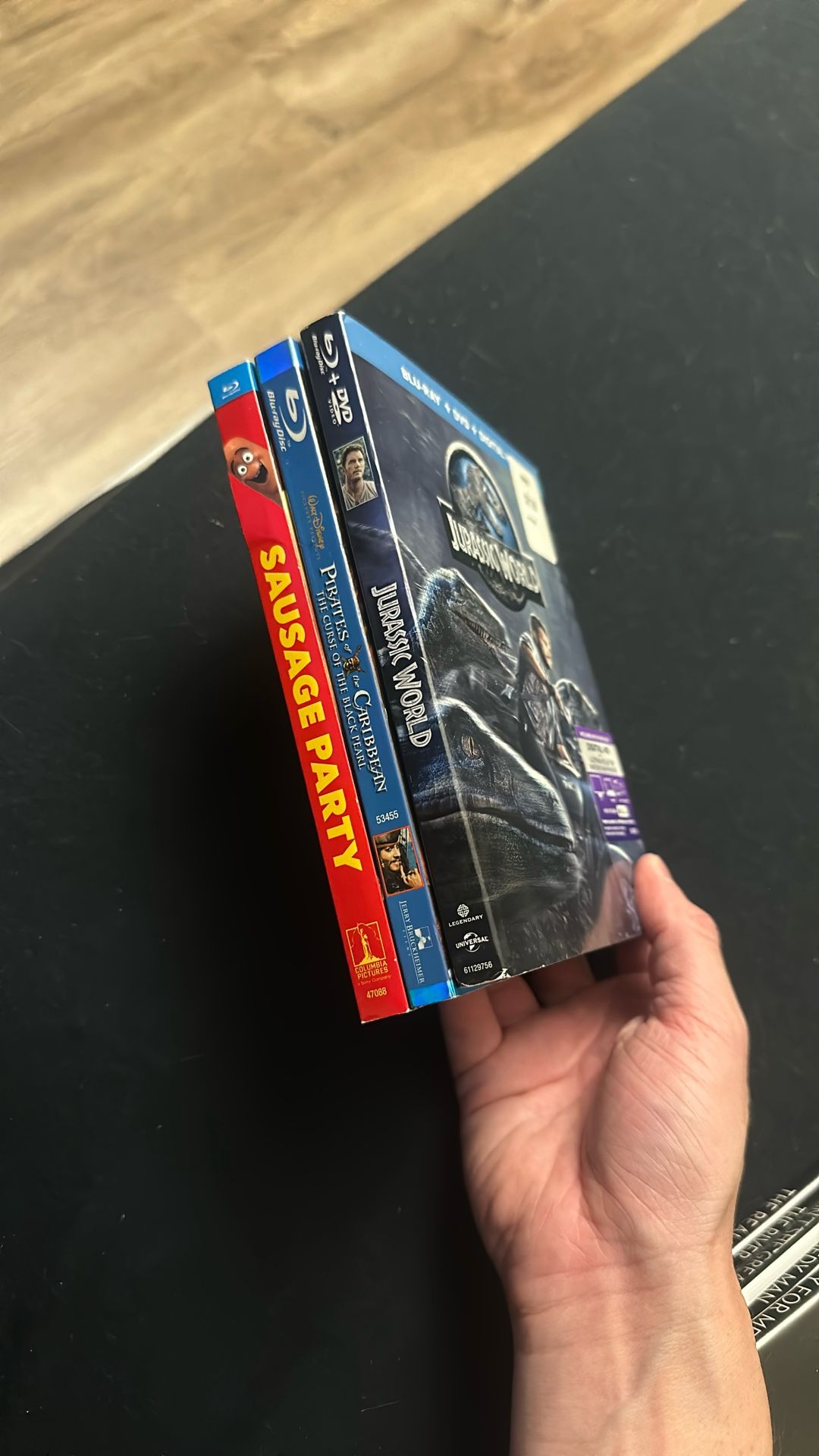 Sausage Party. Jurassic World And Pirates Of The Caribbean Blu Ray Movies With Slipcovers