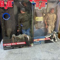 Unopened G.I. Joe figurine, Vietnam wall memorial and a John F. Kennedy PT 109 Boat Commander