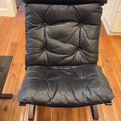 Leather Chair And Ottoman.