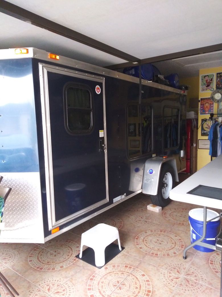 16 ft long x 7 foot wide sleeper No bathroom or shower. Interior height is 56 inches from floor to ceiling high. YOU CANNOT STAND UP IN THIS TRAILER.