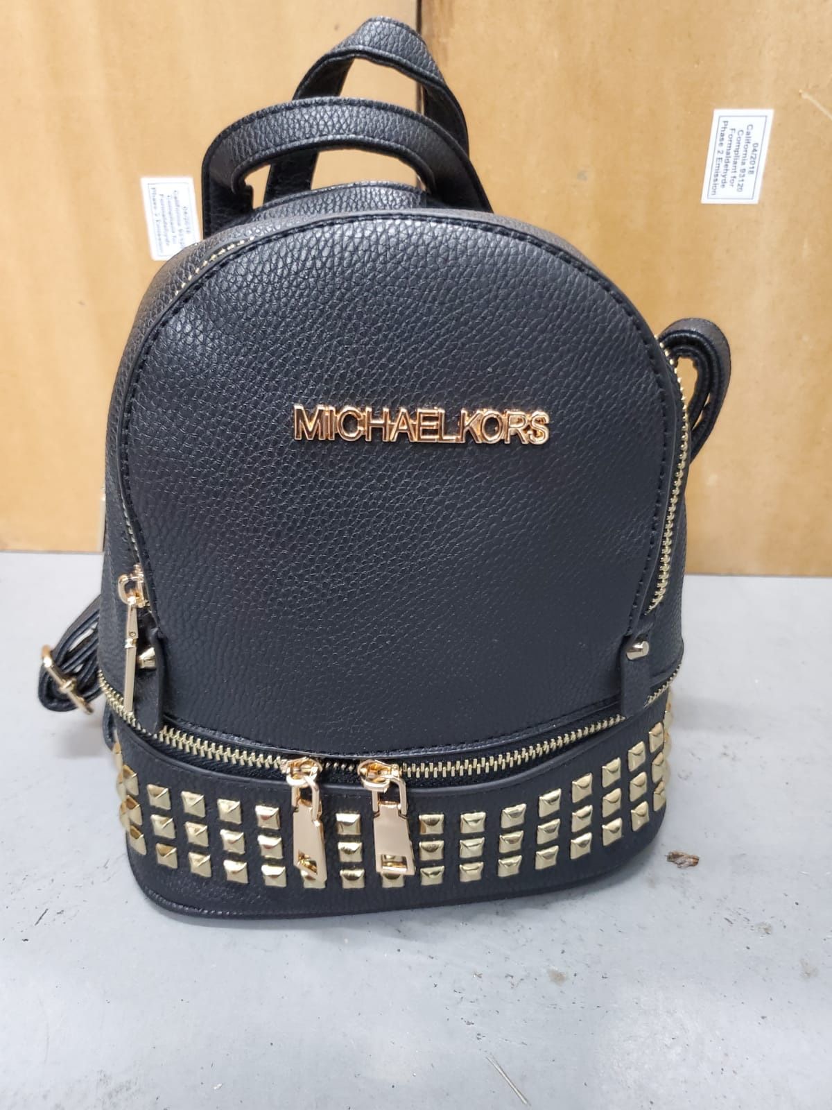 Michael Kors mini backpacks