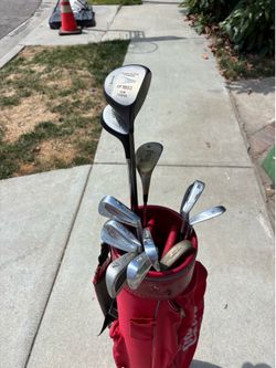 Golf Clubs with Coca-Cola, golf bag and cart