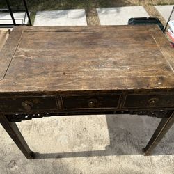 Brown antique desk. Purchased at Mathis Brothers & had been in storage. Rustic, vintage look