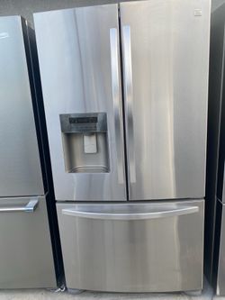 Kenmore beautiful stainless steel refrigerator looks like new French door everything works perfectly first come first served