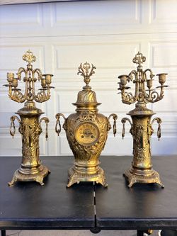 This rare working 19th-century French Rococo brass urn clock set is from J.P. Kluijskens in Amsterda