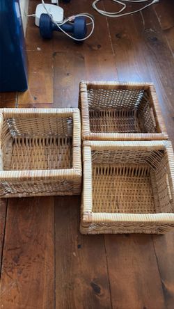 Set of three woven baskets
