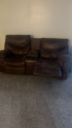Dual leather reclining couch 3 years old. No pets on it Brown 6 1/2 ft. Original owner normal wear