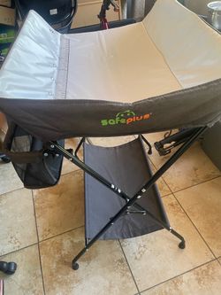 Safeplus folding diaper changing table in dark gray w/ waterproof pad, storage basket, integrated ruler great condition