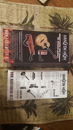 Guitar angled wall hanger for wide body acoustic guitar