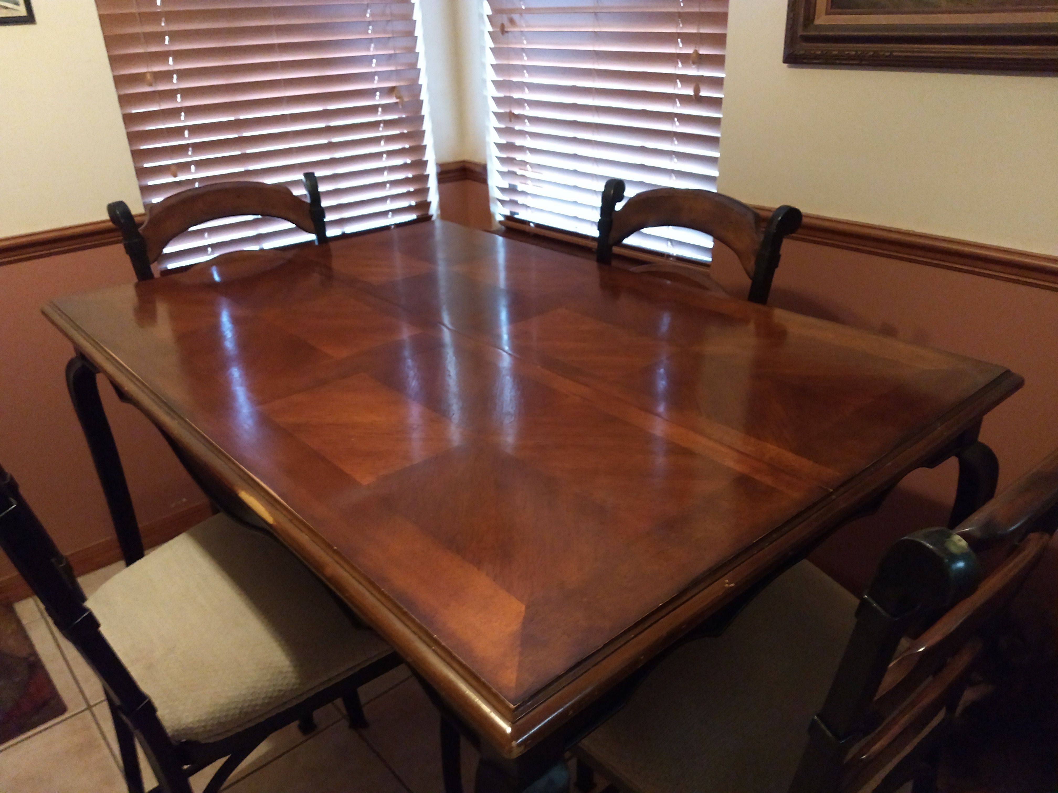 Pub Table 53X53 with Leif inserted 53X35 without has four cushioned chairs