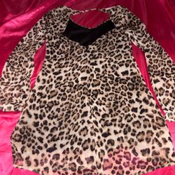 Y2K Leopard Print Open Back Mini DressSuper cute cheetah/leopard print mini dress featuring a low scoop neckline, flowy long sleeves, and a stunning o