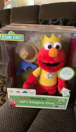 Elmo doll in box. Complete