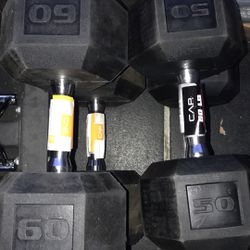 pair of 50 and 60 pound dumbbells