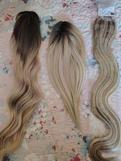 3 beautiful, new, hair pieces 1 a pony tail.