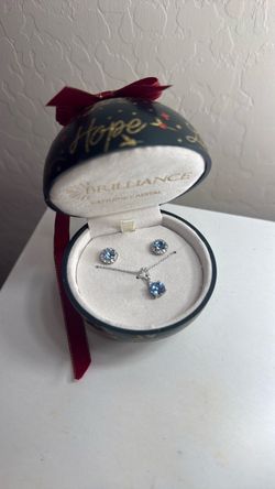 Silver necklace/earring set with blue stone