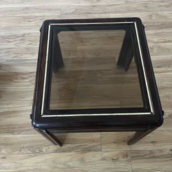  ”Used Wooden End Table with Glass Top”. 