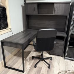 Gray L-Shaped Table with 3 Drawers, 2 Shelves with Doors, and 2 Other Extra Shelves with Black Office Chair