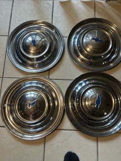 1951 Chevy hubcaps and beauty rings