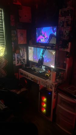 Modern Pc setup yetti mic razor mouse key board two monitors