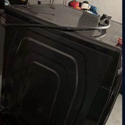 Samsung front-load electric dryer in a dark finish, likely brushed black or black stainless steel. 