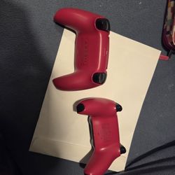 Two cosmic red PS5 controllers 