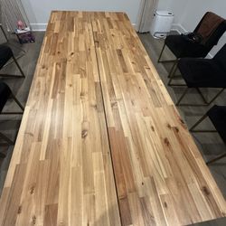 IKEA SKOGSTA dining table in acacia wood with black legs