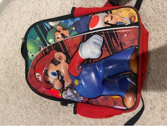 Mario Bros backpack and Luigi doll