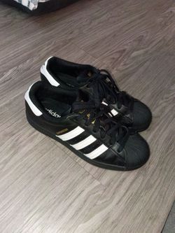 Adidas black and white woman's 8.5 men's 6 1/2
