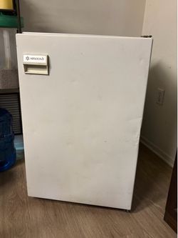 Absocold mini fridge with a compact freezer compartment