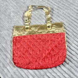 Women’s red quilted tote bag with gold trim trimming