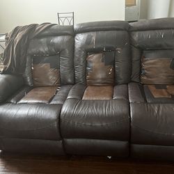 Leather sofa with recliner and sofa cover