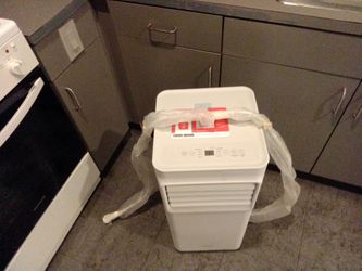 Small air conditioner. Plugs in by wall outlet. Works great. I'm located in Los Angeles