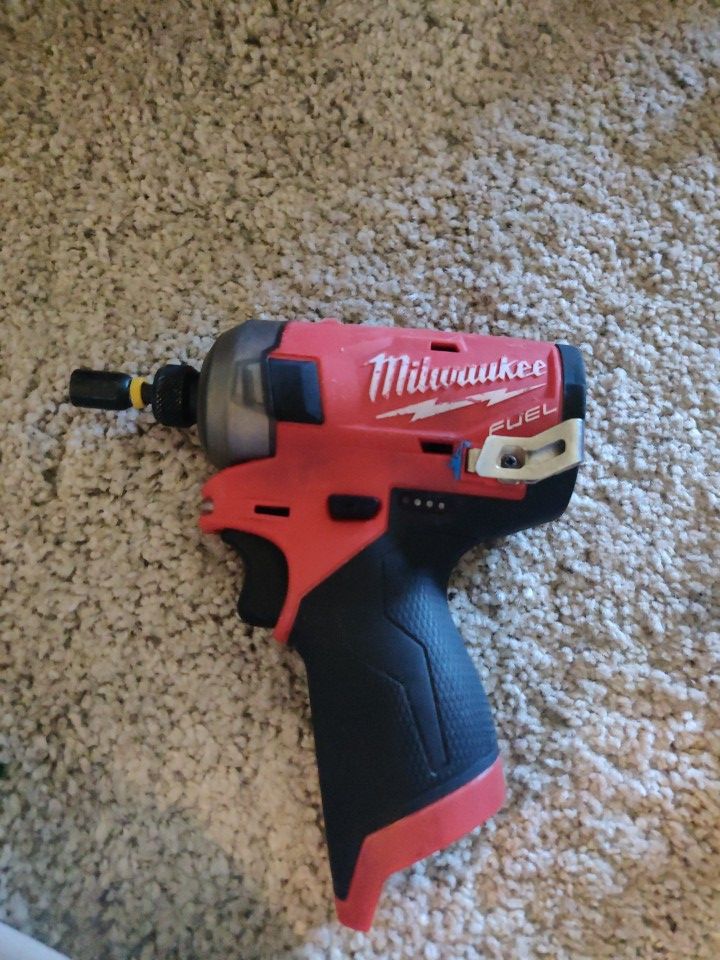 Milwaukee M12 Brushless Impact Fuel Surge drill with 2 batteries, charging port and bag carrier