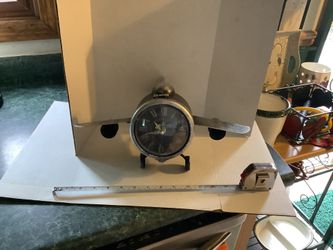 Metal Airplane clock working display piece. Approximately 14” wide, 7.5” tall, 9” deep Incredible details, great conversation piece Plainfield, Illino