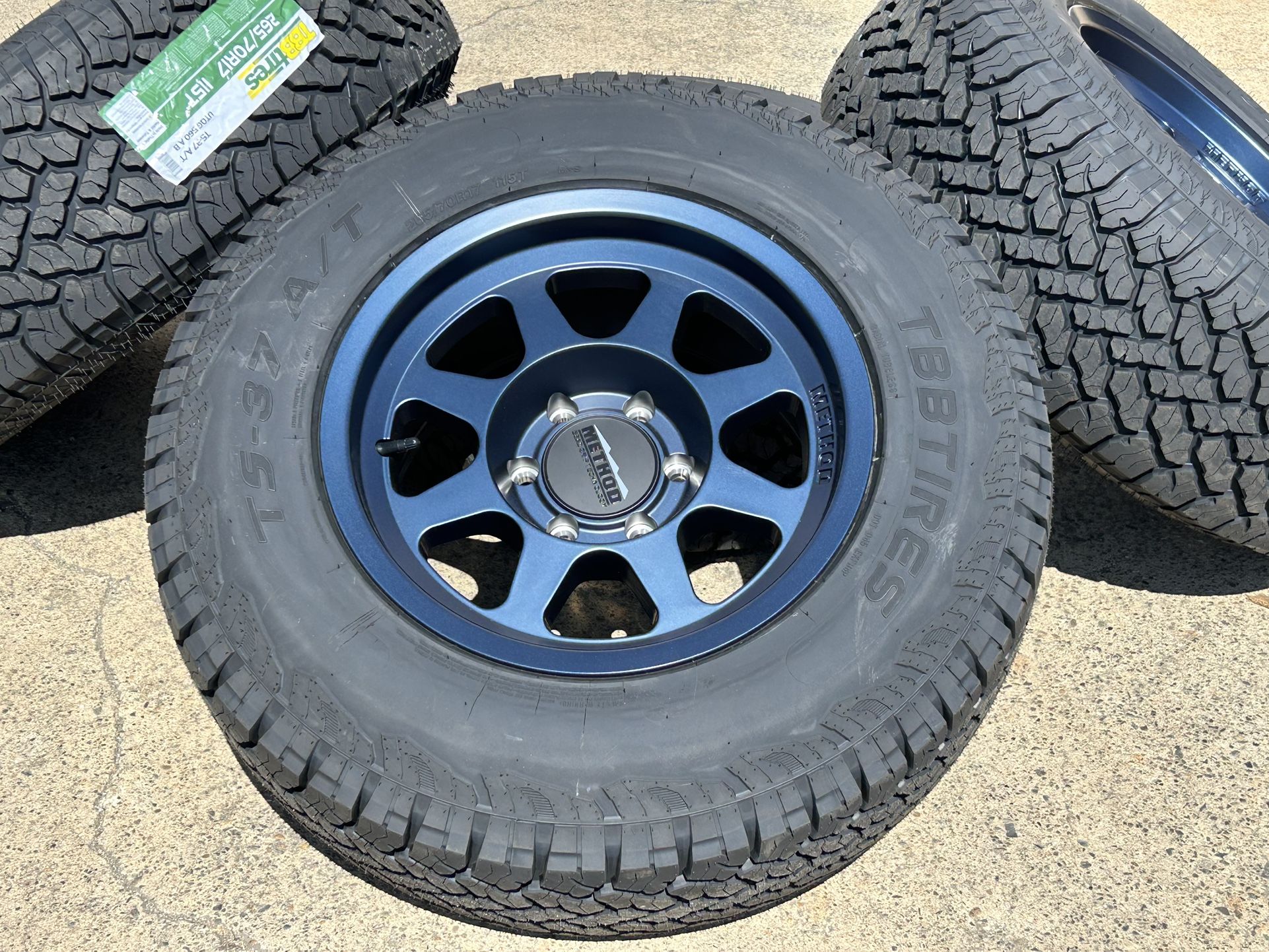 4 NEW Method MR701 Bead Grip Bahia Blue wheels -12mm 6x5.5 17x9 Tires Fits Chevy Toyota Ram 1500 GMC