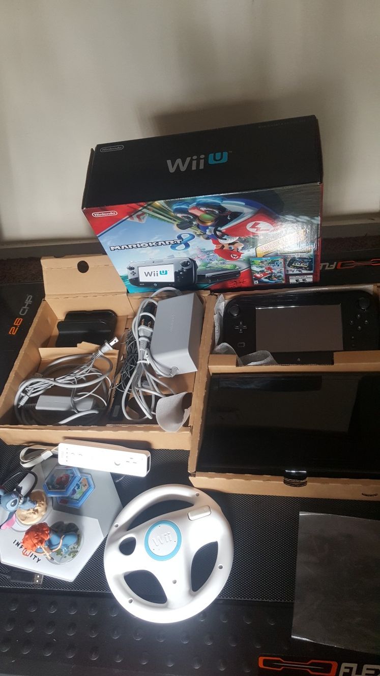 NINTENDO WII U DELUXE 32GB SET IN BOX. COMES WITH POKKEN TOURNAMENT & MARIO KART 8 GAMES ON IT.