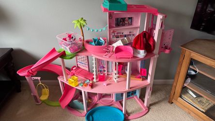 Barbie dollhouse and a lot of Barbie dolls and accessories