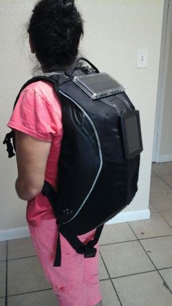 Solar powered motorcycle backpack