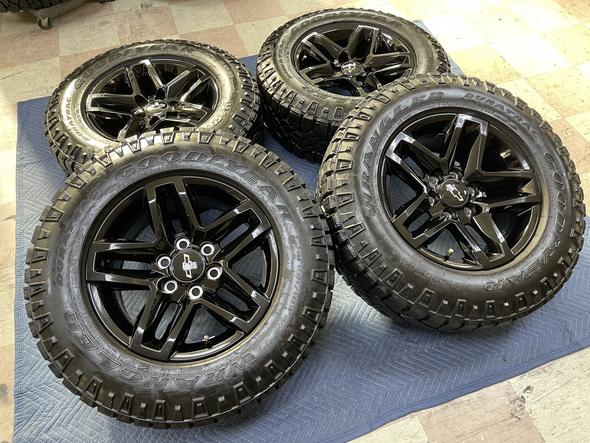 (4) 18” CHEVY SILVERADO TRAILBOSS BLACK FACTORY WHEELS & GOODYEAR WRANGLER DURATRAC LT275/65R18
