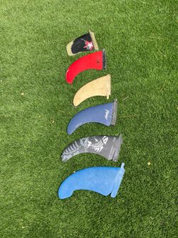 Surfboard or windsurfing fins