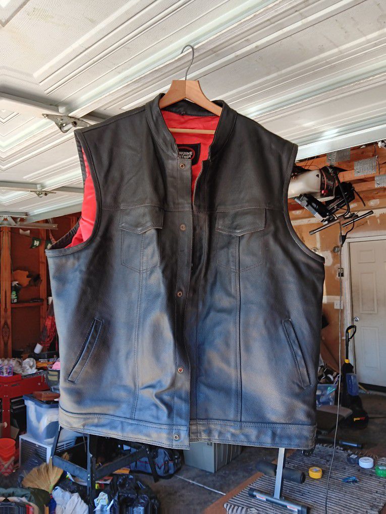 Genuine leather red and black motorcycle vest.What?What two pockets on the inside for concealed carry