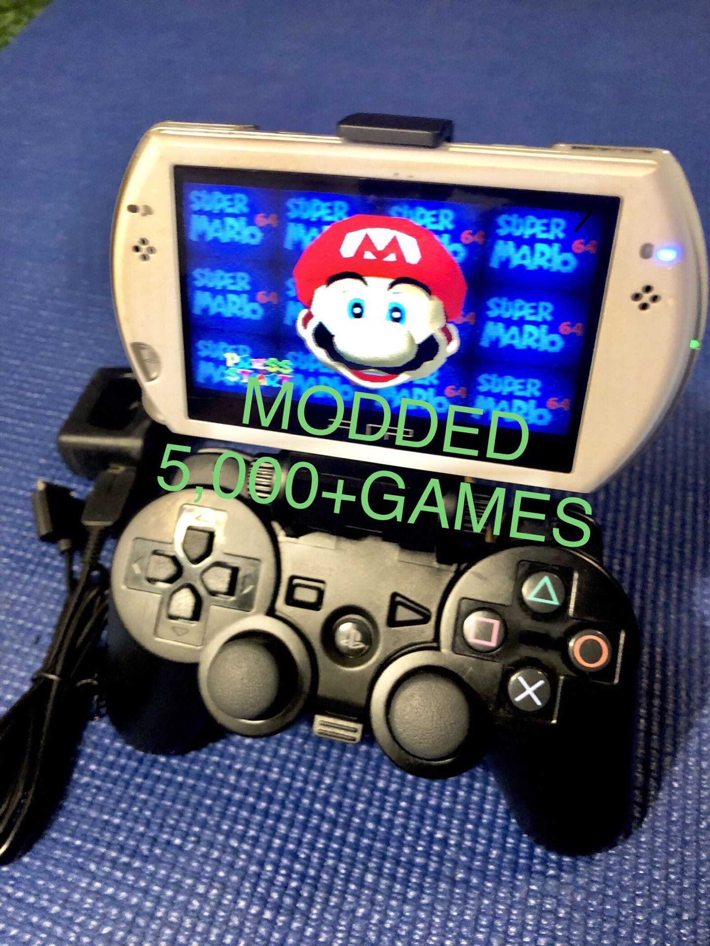 Custom Hacked/Modded PSP GO with DualShock 3 Controller/Clip and over 5,000 N64, PS1, PSP, NES, SNES, MAME, CAPCOM, ATARI, GBA, GB/GBC games