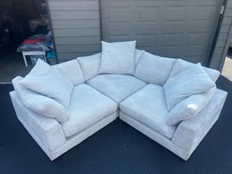 Couch: Cream corduroy sectional with chaise