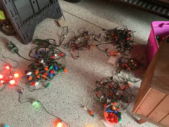 Vintage Christmas lights both large and medium size bulbs there are Four - 26 foot strands with large bulbs C9 bulbs Six - 26 foot strands with mediu