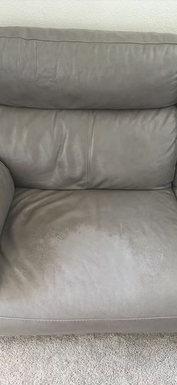 Reclining leather couch and oversized chair