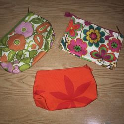 New & gently used bright floral Clinique cosmetic bags