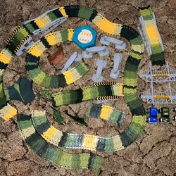 Dinosaur Flexible Race Track w/ Motorized Turntable and Dinosaur Adventure Playset (2 different sets)