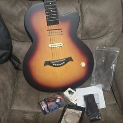 Awesome MouKey acoustic guitar. Has cool sunburst finish and cutaway body. Comes with gig bag, capo, tuner, and extra strings. All set to play.$120